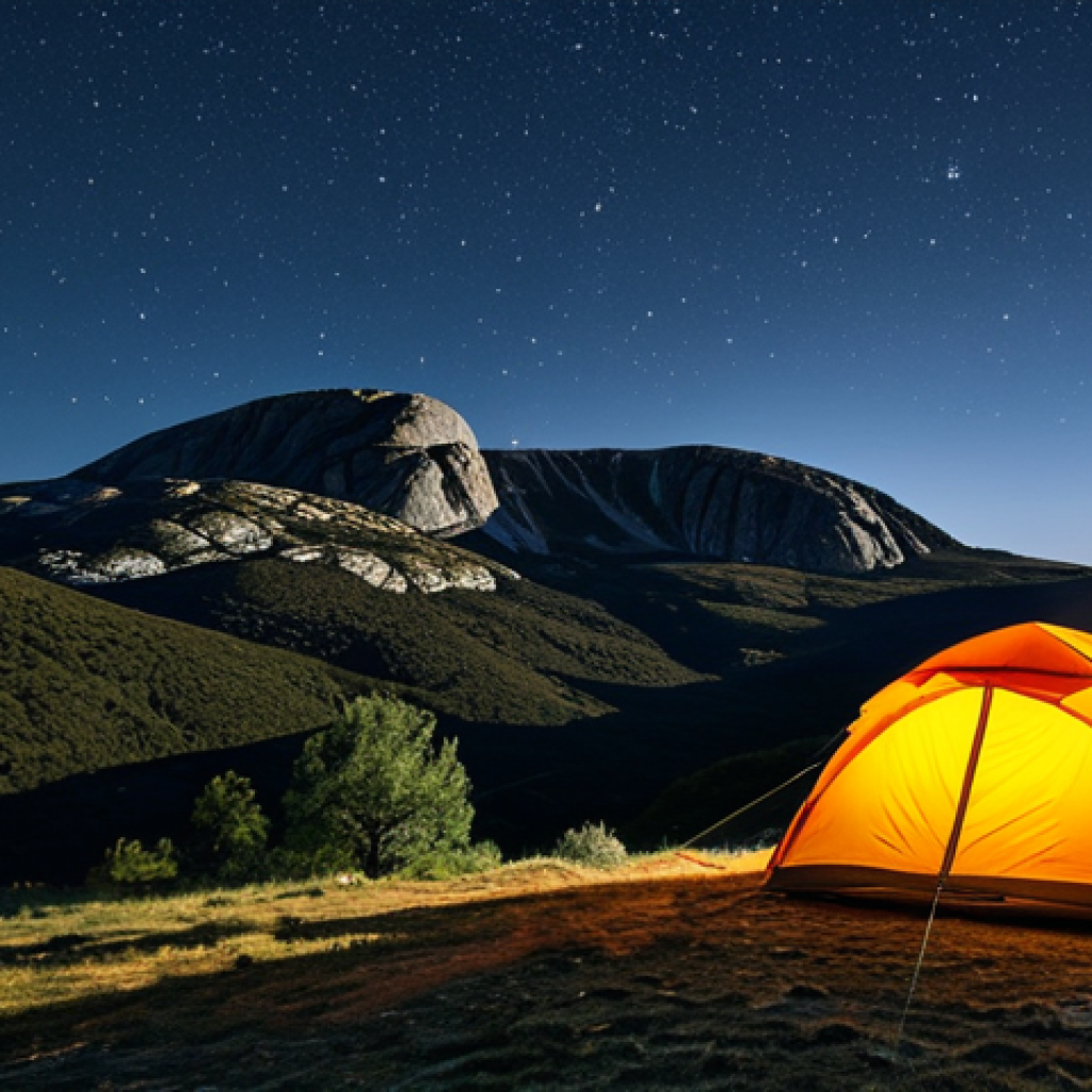 오프그리드 여행을 위한 최적의 장소 - **Serra da Estrela Landscape:** "Majestic mountains of Serra da Estrela under a starlit sky, tent ne...