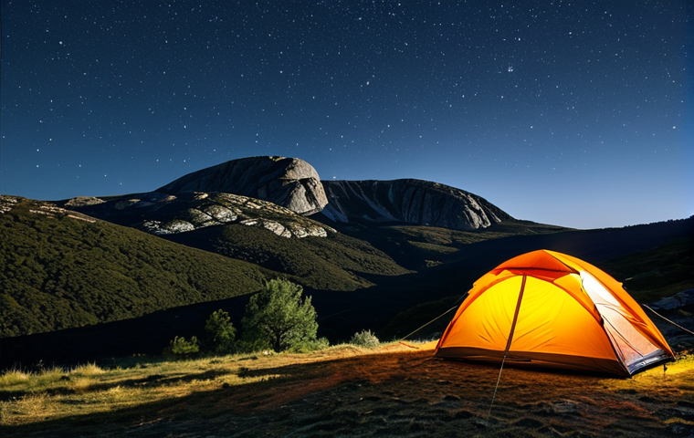오프그리드 여행을 위한 최적의 장소 - **Serra da Estrela Landscape:** "Majestic mountains of Serra da Estrela under a starlit sky, tent ne...